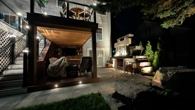 Project Wildfire rooftop lounge and outdoor fireplace at night